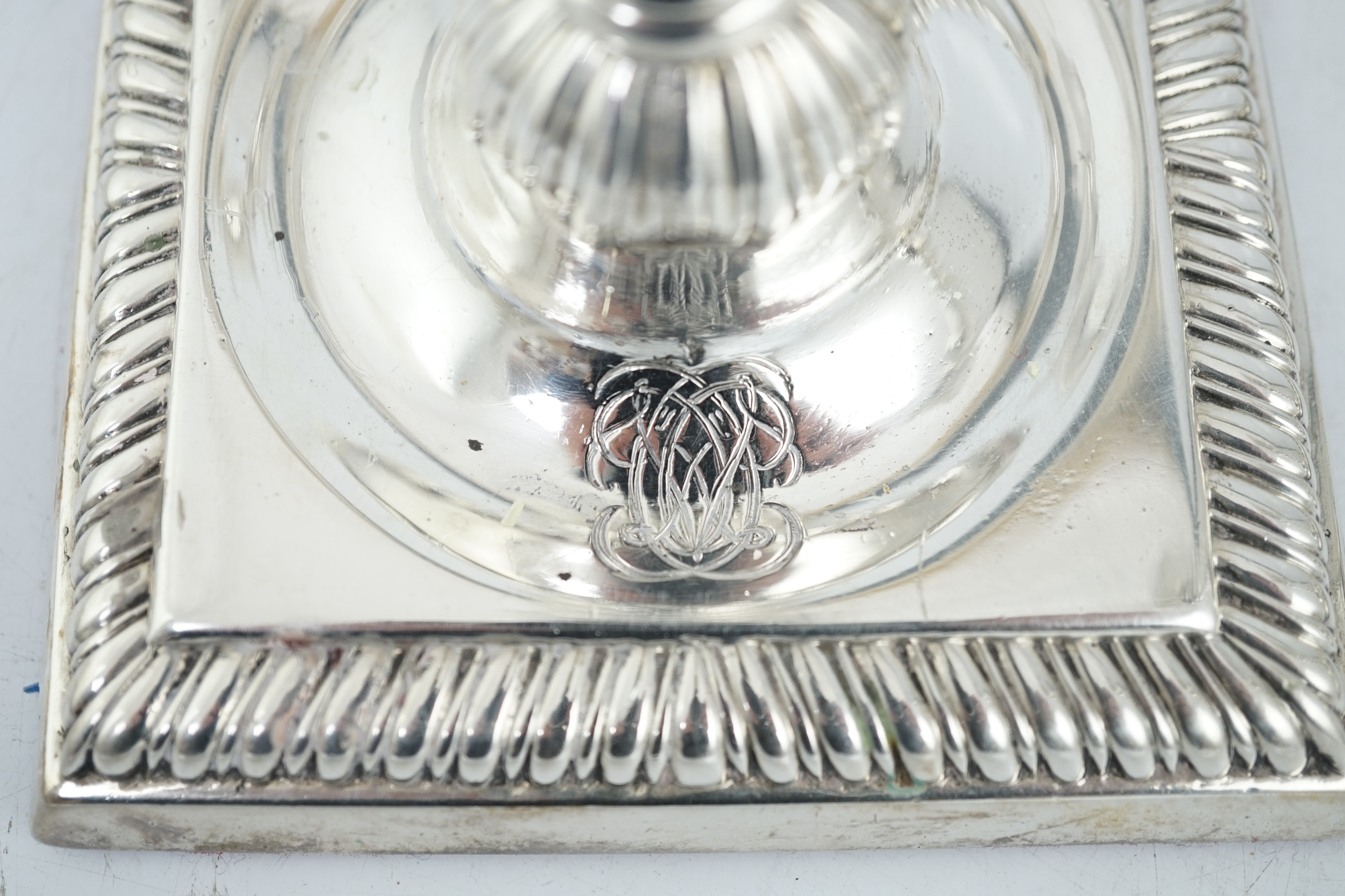 A matched set of four George III silver candlesticks